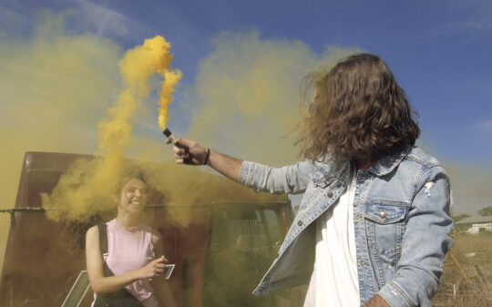 playing-with-a-yellow-smoke-bomb